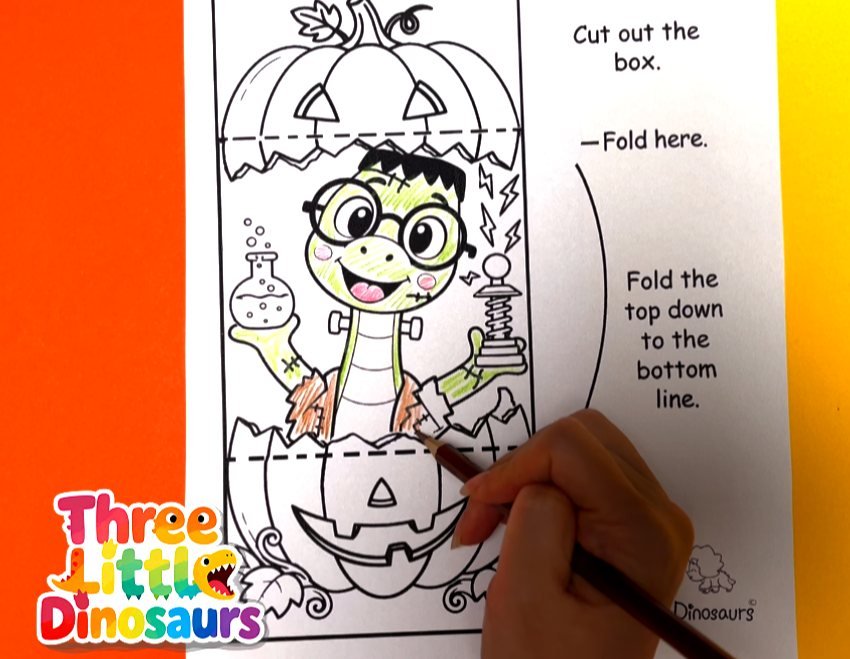 Leonardo Frankenstein dinosaur pumpkin card colored with crayons